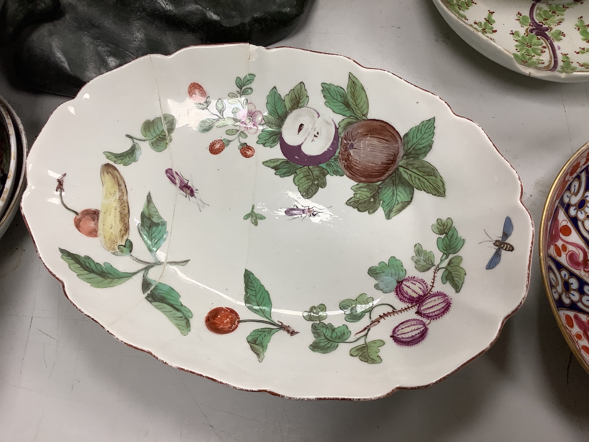 An Assortment of 18th century Worcester and Chelsea porcelain tableware and a Derby figure, damaged